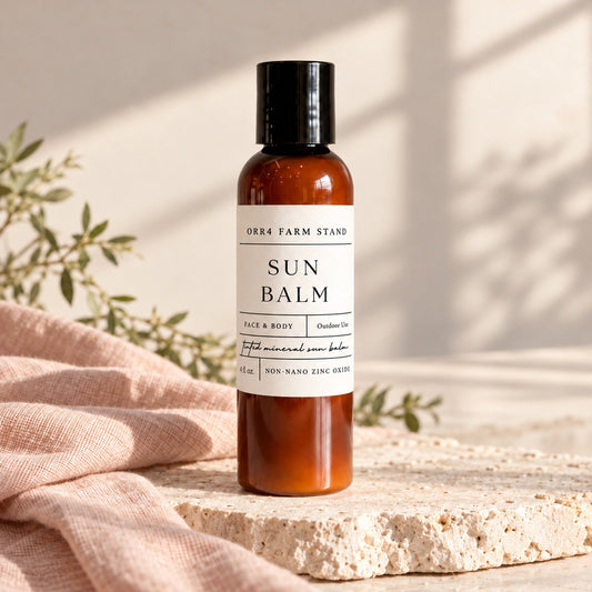 Orr4 Farm Stand tinted Sun Balm with current label, styled product photograph